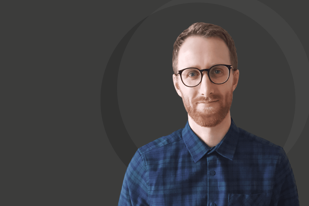 Introducing Matt Brown, a man wearing glasses and a plaid shirt.